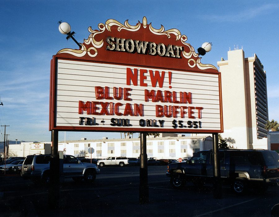 The Showboat roadside marquee advertising the new Blue Marlin Mexican buffet, Friday through Sunday only, five dollars ninety-five, with the hotel tower behind
