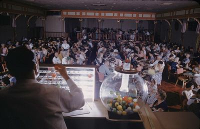 A crowd at the Showboat's gaming tables in June 1955