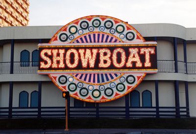 A round Showboat logo emblem mounted on the hotel's exterior wall