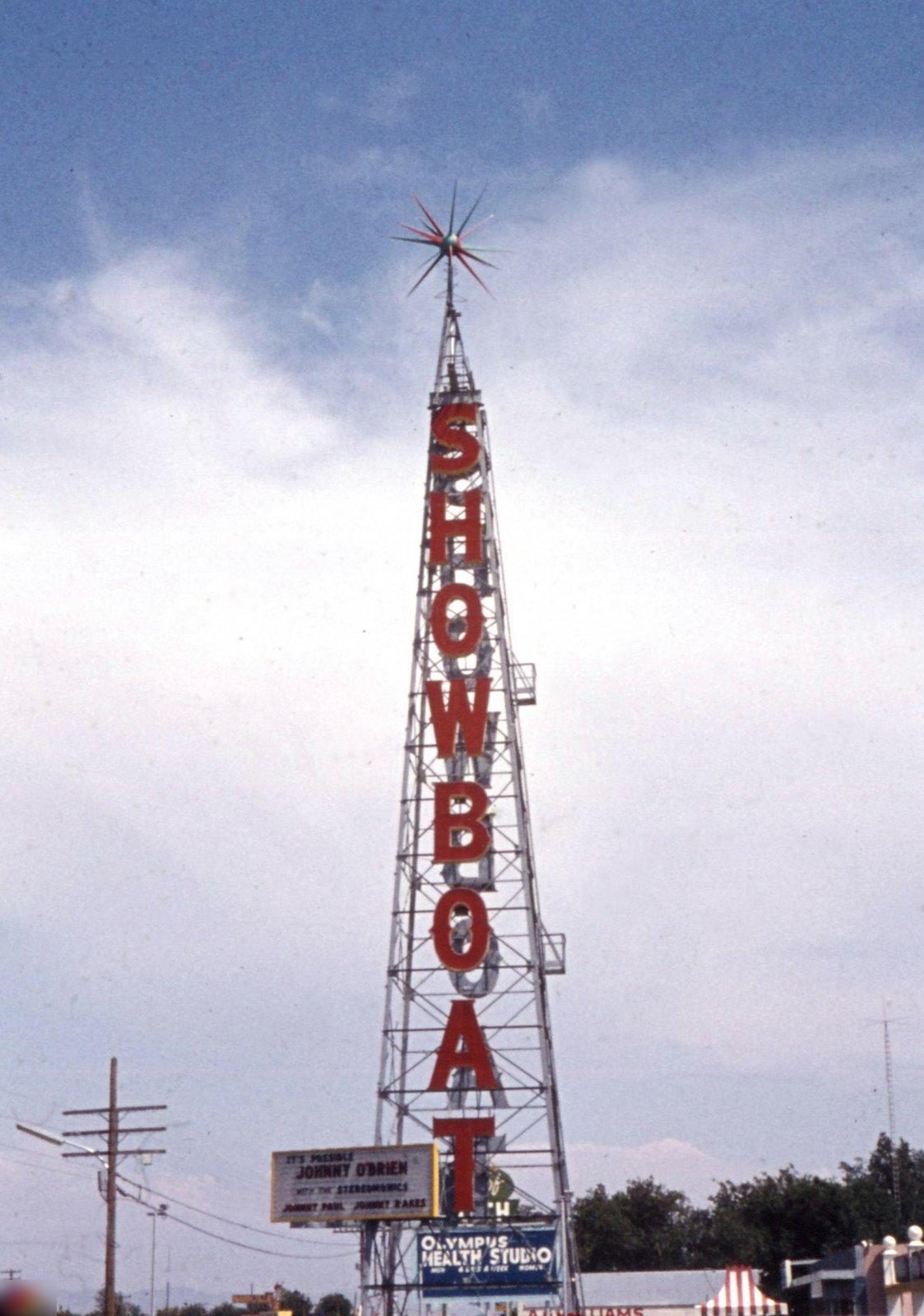 The tall vertical SHOWBOAT roadside sign photographed against the sky in 1968